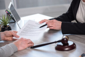 Criminal Defense Lawyer showing document to the client