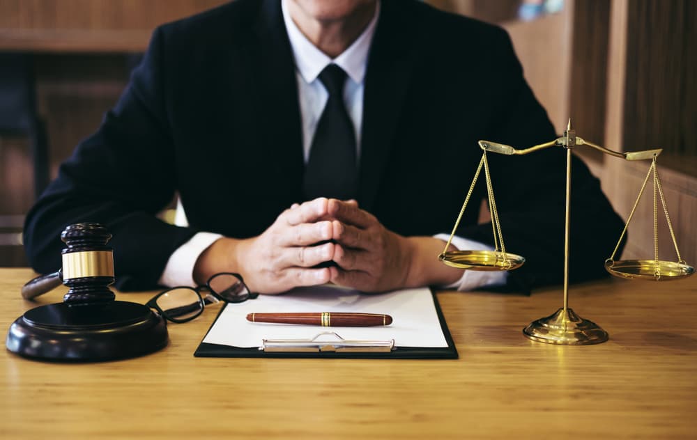 Criminal Defense Attorney with Judge's gavel and Justice Scale