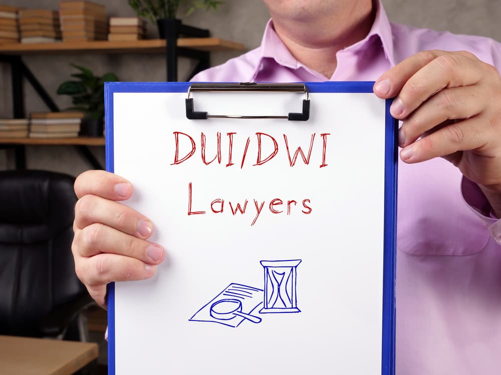 DUI DWI Lawyers with sign on the piece of paper